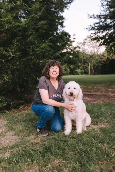 sit means sit trainer posing with dog